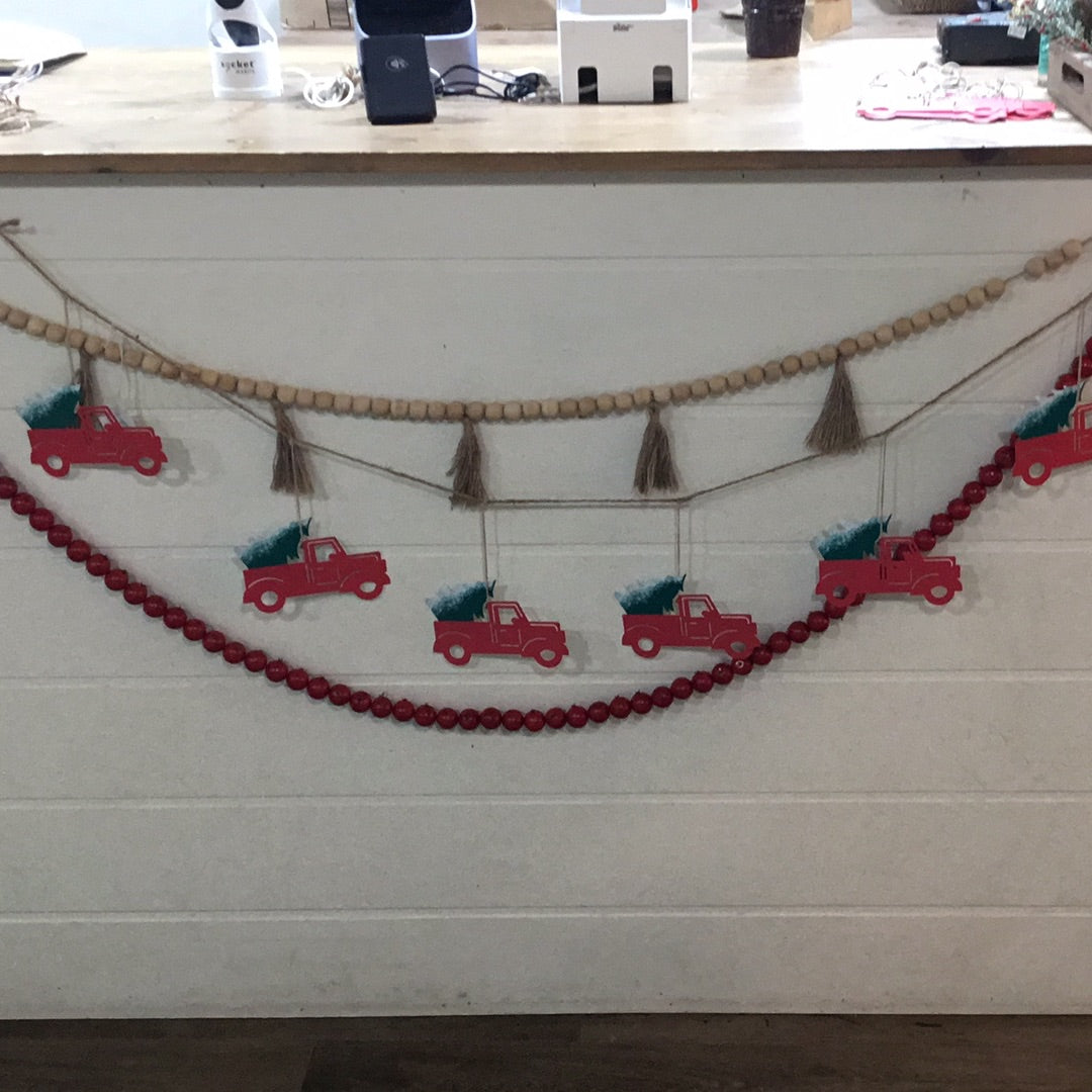 Red truck with tree garland